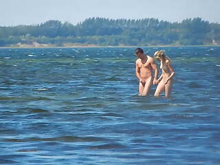 naked couple in the sea