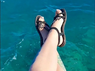 Dominatrix excite you with her feet on the sea