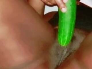 Tight girl masturbating with cucumber 
