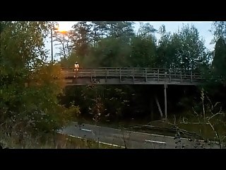 completely naked flashing traffic from a bridge