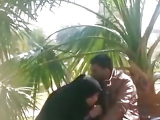 An Iraqi girl sucks her lover 's penis in a public place