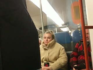 Young blonde girl can't take her eyes of bulge in train