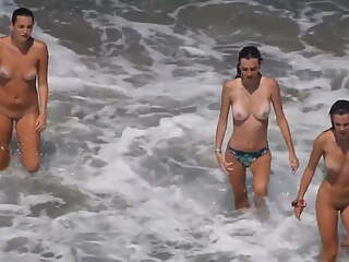 3 busty teen are naked at the beach