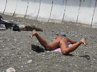 Naked pussy on a nudist beach