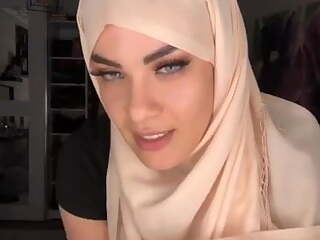 Arab girl wearing a hijab in leggings, big boobs