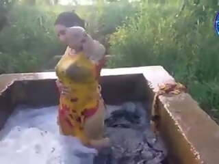 Pakistani girl in water pool washing 