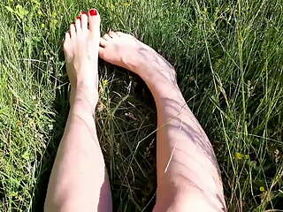 Foot fetish outdoors in a public place