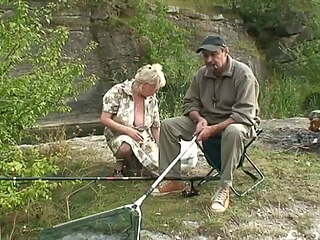 Two elderly people go fishing and find a young girl