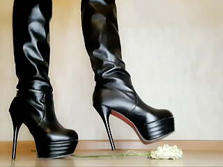 Dominatrix tramples roses with her beautiful shoes