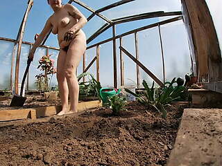 Naked Greenhouse Worker Planting Cacti