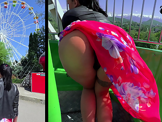 Ferris wheel in the park - girl sucks cock and shows her charms