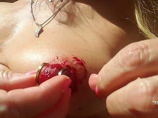 nippleringlover horny milf nude outdoors peeling huge red painted pierced nipples close up