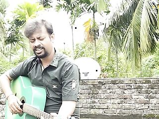 DESI COUPLE SINGING WITH GUITER IN ROOF (OUTDOOR)