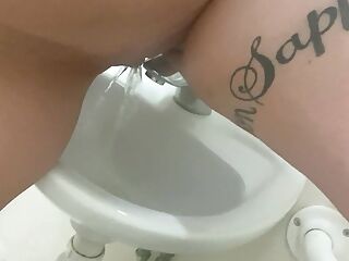 Pissing in the work sink and playing with it