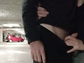 jim pulls out his big cock in a public parking lot with a passing car