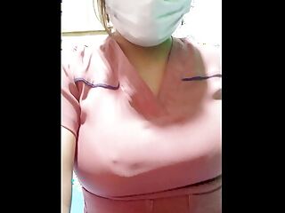 The beautiful nurse flirts with her boss while they are on video call, she shows him her cute youthful tits