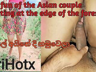The fun of the Asian couple meeting at the edge of the forest