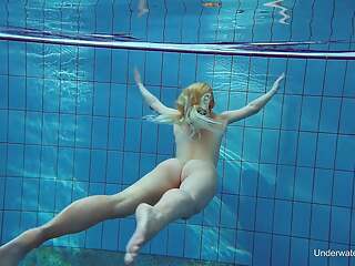Russian blonde perfection swimming in the pool
