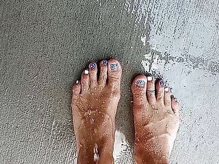 Showing off our feet and pedicures while wet