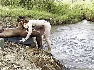 Outdoor sex sunbathing by the river I put two hot girls to suck and tore them both cumming inside