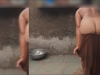 The elder sister-in-law is watching the brother-in-law in the open bathroom after going home naked after walking in the open for