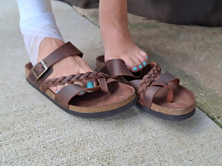 rocking on her swing ignoring me and playing with her leather sandals
