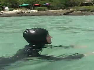 Girls in latex on the beach