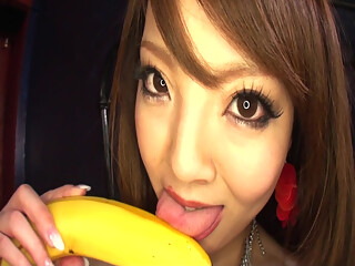 The great Hitomi sucks and tit-fucks a banana then gets all
