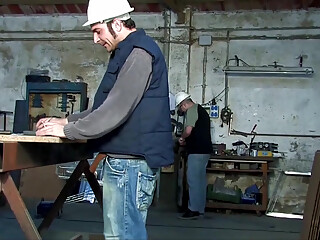 Two young sluts get fucked by workers in a garage